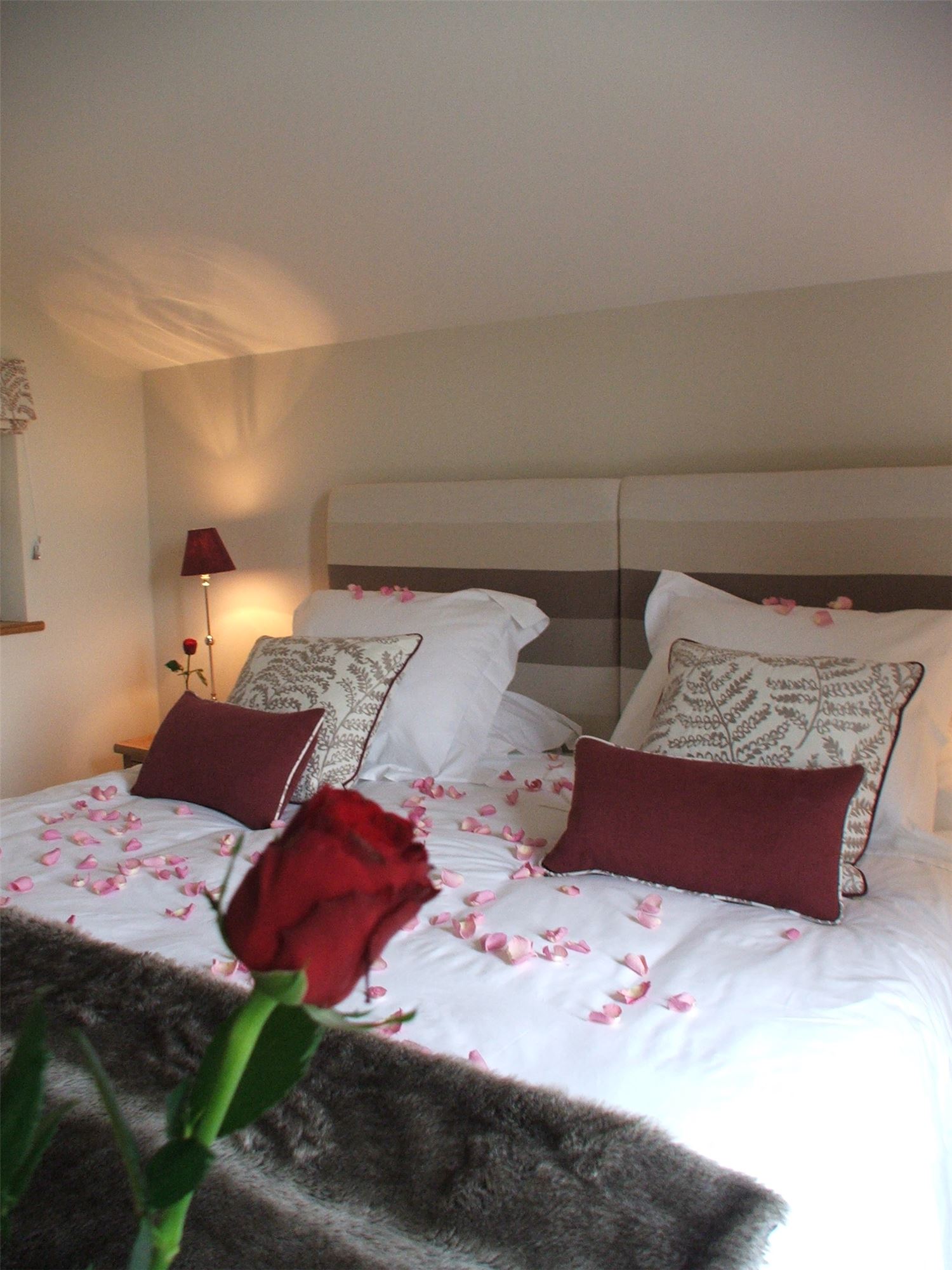 bed decorated with rose petals 